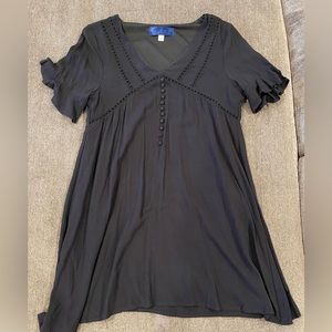Black short dress with buttons and details